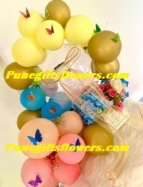 balloons with butterflies and artificial flowers