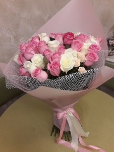 Delicate 30 Pink and White Roses Bouquet in white and pink net wrapping bound with pink ribbons