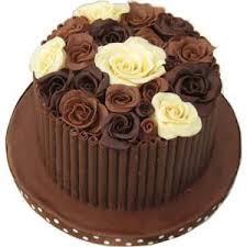 half chocolate cake with chocolate roses on top