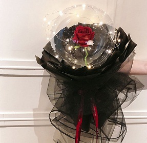 Transparent balloon with 1 red rose black wrapping and fairy lights Only for Pune