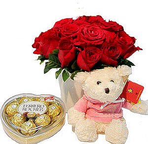 12 Red roses with Heart shaped chocolate box and Teddy (6 Inches)